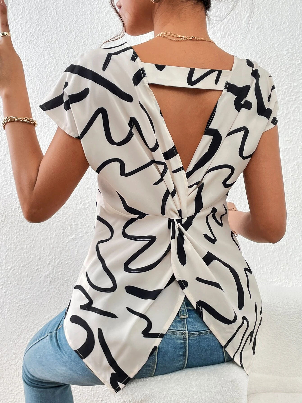 Unity Graphic Print Twist Back Cut Out Batwing Sleeve Blouse